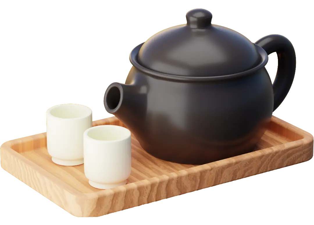 Une théière noire en fonte et deux tasses sur un un plateau